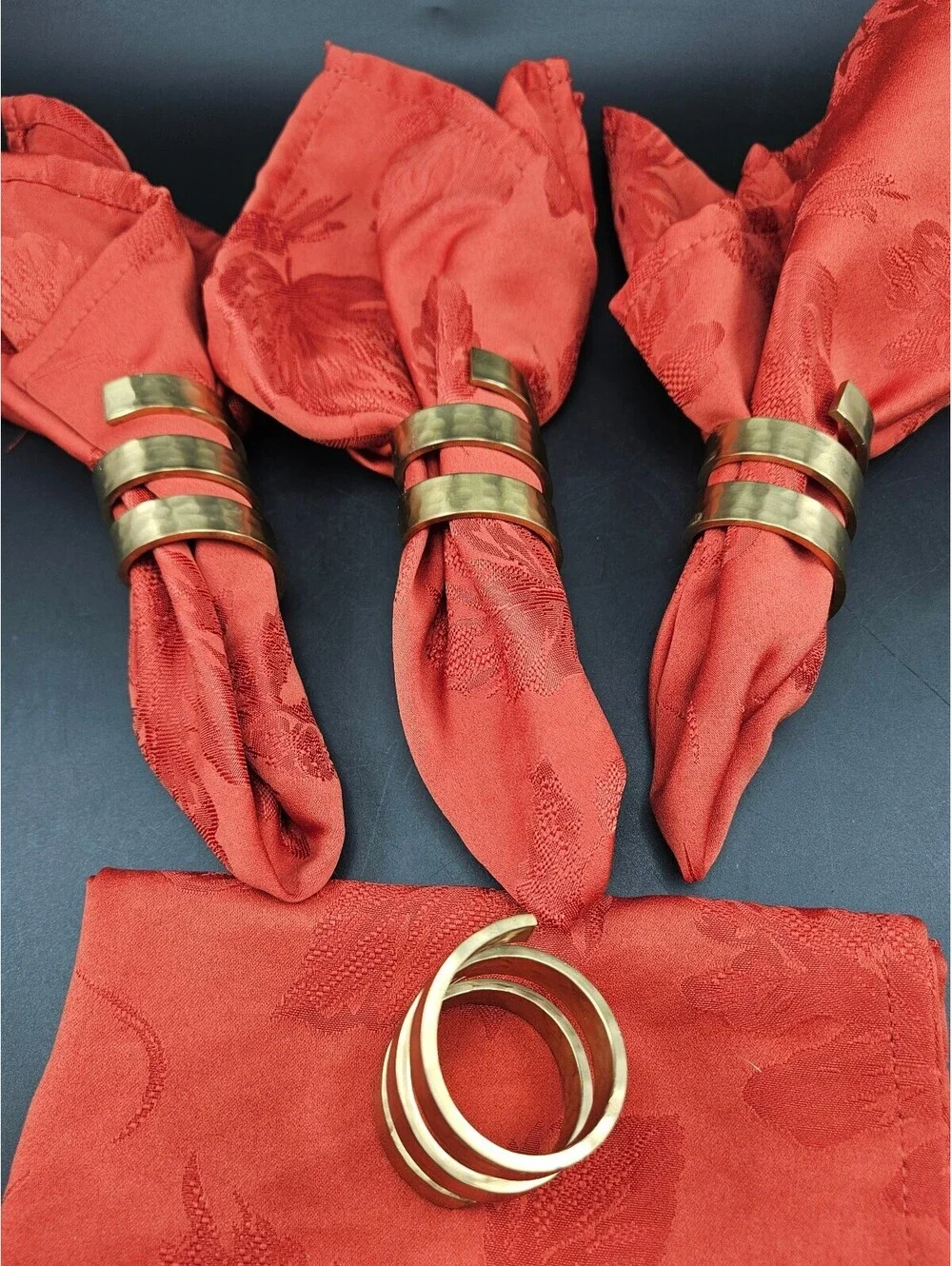 Set of 4 Spiral Hammered Brass Napkin Rings and 4 Red Napkins